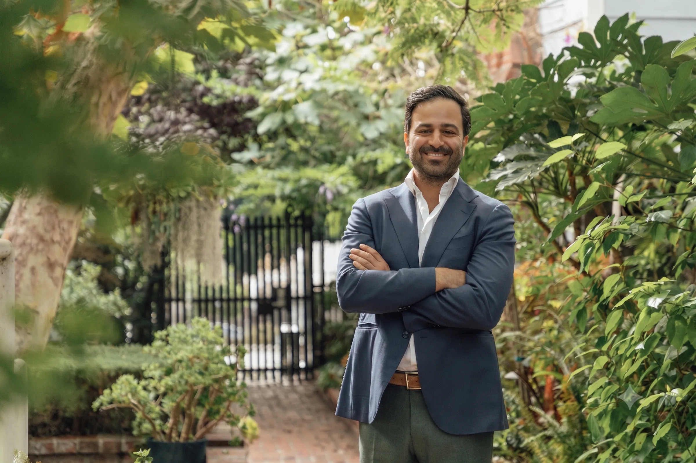 Dr. Mike Mah standing in the garden outside his Century City office