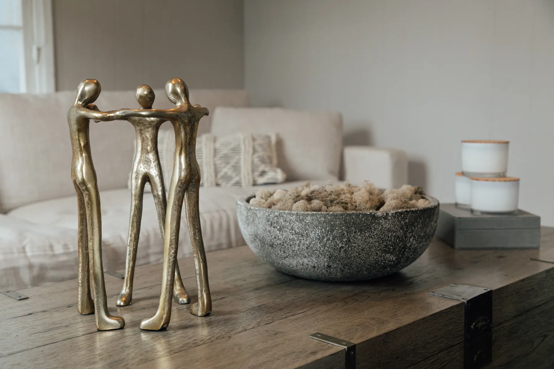 Brass figure sculptures on a table in Dr. Mike Mah's Century City office